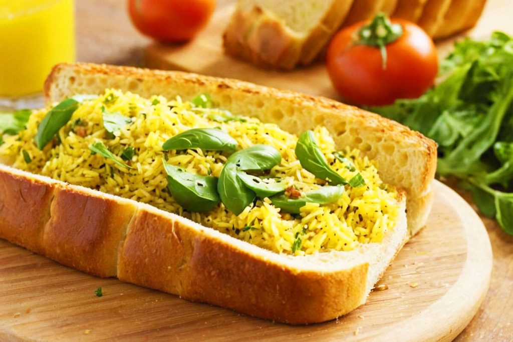 Garlic bread and salad with yellow rice.