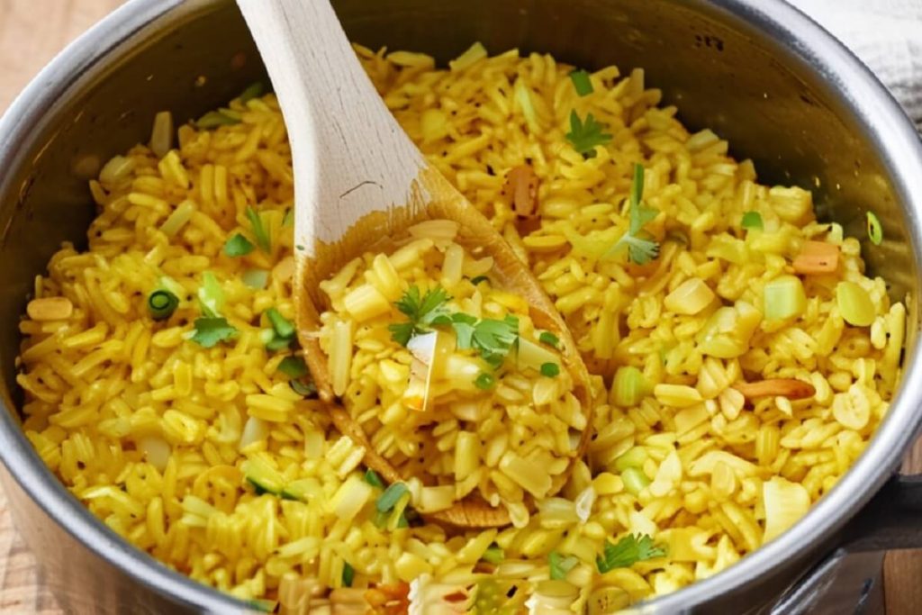 A variety of dishes paired with yellow rice, including grilled shrimp, roasted vegetables, and a chicken curry.